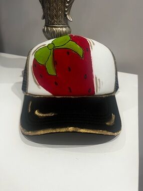 White and Black Strawberry Trucker Hat with Green Bow